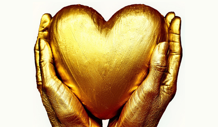 Golden hands holding a golden heart