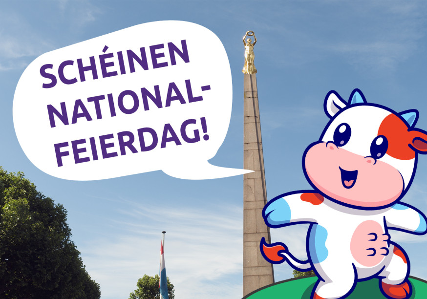 Cow mascot in front of the Golden lady wishing a happy national holiday in Luxembourgish
